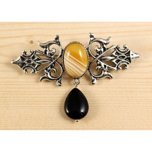 Брошь из агата желтого (тонир.) "вензель", основа 70х2.4мм, овал 18х13мм, подвеска агат черный