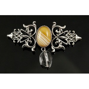 Брошь из агата желтого (тонир.) "вензель", основа 70х2.4мм, овал 18х13мм, подвеска горный хрусталь