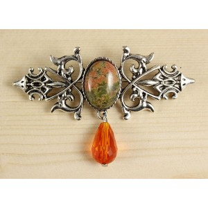 Брошь из унакита "вензель", основа 70х2.4мм, овал 18х13мм, подвеска оранжевая