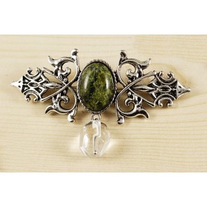 Брошь из змеевика "вензель", основа 70х2.4мм, овал 18х13мм, подвеска горный хрусталь