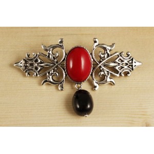 Брошь из коралла красного (иск.) "вензель", основа 70х2.4мм, овал 18х13мм, подвеска гранат