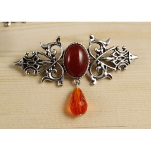 Брошь из сердолика "вензель", основа 70х2.4мм, овал 18х13мм, подвеска оранжевая