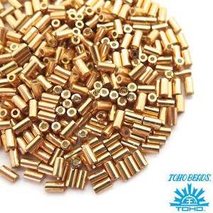 Стеклярус TOHO BUGLE 3 мм № 0557 золото 5 граммов Япония