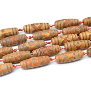 Бусины Дзи "Три глаза" из агата матового бочонок 14*39мм, 38см, 8 бусин Бусины Дзи "Три глаза" из агата матового бочонок 14*39мм, 38см, 8 бусин