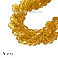 Бусины хрустальные биконус 6 мм светло-медовый нить ок. 29 см/49 штук