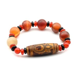 Браслет с бусиной дзи "Кубера" бочонок 14*40мм с сердоликом матовым шарик 14мм Браслет с бусиной дзи "Кубера" бочонок 14*40мм с сердоликом матовым шарик 14мм