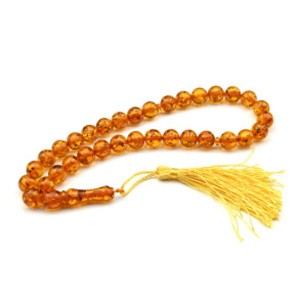 Четки из янтаря шарик 12мм цвет светло-коньячный, 44см, 33 бусины (иск.) Четки из янтаря шарик 12мм цвет светло-коньячный, 44см, 33 бусины (иск.)