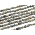 Бусины из лабрадорита галтовка 9*11мм, 37см, 36 бусин Бусины из лабрадорита галтовка 9*11мм, 37см, 36 бусин
