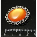 Брошь пластик оранжевый (эффект опала), с ажурным контуром, цвет ант. серебро, овал 25х18мм