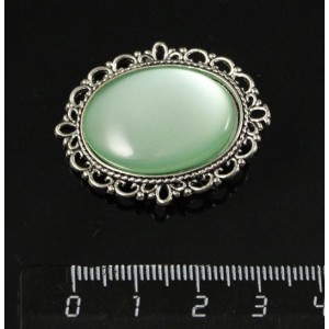 Брошь пластик мятный (эффект опала), с ажурным контуром, цвет ант. серебро, овал 25х18мм