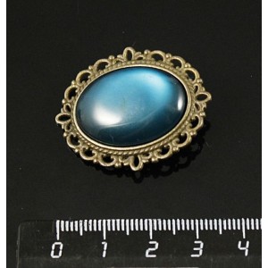 Брошь пластик изумрудный (эффект опала), с ажурным контуром, цвет бронза, овал 25х18мм