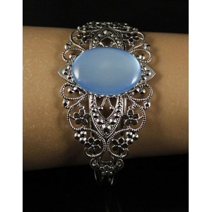 Браслет пластик голубой (эффект опала), овал 25х18мм, жесткая основа, цвет ант.серебро