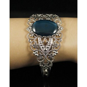 Браслет пластик изумрудный (эффект опала), овал 25х18мм, жесткая основа, цвет ант.серебро