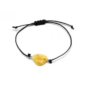 Браслет с Руной Вирд из янтаря 10*17мм на шнурке цвет медово-молочный