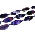 Бусины из агата тонированного т.овал 25*50мм цв.фиолетовый витой, 42см, 7 бусин