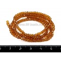 Бусины хрустальные Рондель 4*3,5 мм коричневый прозрачный около 40 см нить