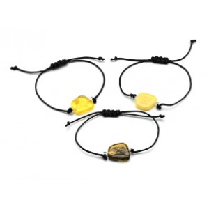 Руна Дагаз на браслете с янтарем 10*17мм на шнурке цвет медово-молочный Руна Дагаз на браслете с янтарем 10*17мм на шнурке цвет медово-молочный