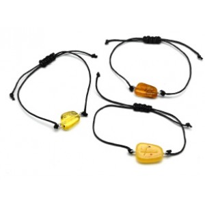 Браслет с Руной Наутиз из янтаря 10*17мм на шнурке цвет медово-молочный