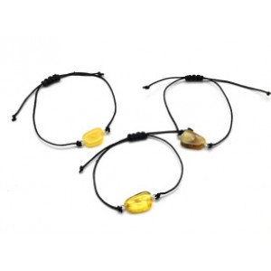 Браслет с Руной Турисаз из янтаря 10*17мм на шнурке цвет медово-молочный