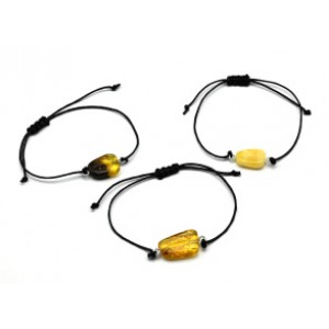 Руна Тейваз на браслете с янтарем 10*17мм на шнурке цвет медово-молочный