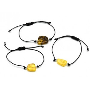 Браслет с Руной Эйваз из янтаря 10*17мм на шнурке цвет медово-молочный