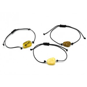 Браслет с Руной Йера из янтаря 10*17мм на шнурке цвет медово-молочный