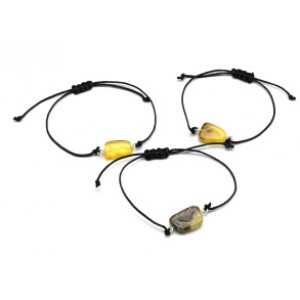 Браслет с Руной Кеназ из янтаря 10*17мм на шнурке цвет медово-молочный