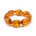 Браслет крупный из янтаря галтовка 15*25мм цвет коньячный, 17см (иск.)