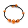 Браслет с каучуком и янтарем на пружинке шарик 12мм, рис 9*12мм цвет коньячный, 17см (иск.)