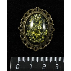 Брошь из янтаря иск., цвет зеленый, овал 25х18мм, оправа с узором цвет бронза