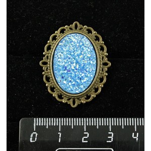 Брошь c кабошоном из пластика "щетка кристаллов",  цвет морская волна, овал 25х18мм, оправа с узором цвет бронза