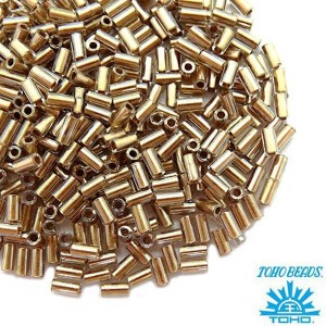 Стеклярус TOHO BUGLE 3 мм № 0989 прозрачный с золотистым отверстием 5 граммов Япония