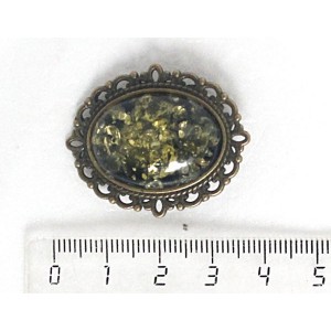 Брошь из янтаря, цвет зеленый, овал 25х18мм, оправа с узором цвет бронза