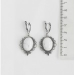 Серьги из камня каулит (имитация кахолонга), овал 18х13мм, оправа "трилистник", швензы посеребрение