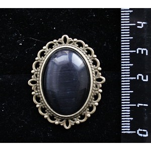Брошь из кошачьего глаза (синт.), овал 25х18мм, цвет черный, оправа с узором цвет бронза
