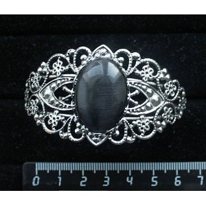Браслет из кошачьего глаза (синт.), овал 25х18мм, цвет черный, жесткая основа, цвет ант.серебро