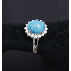 C925 Кольцо родиум с бирюзой (имитация) "овал в цирконах" р-р 18