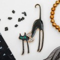Брошь "Кошка грациозная с бантиком", цвет черный, цвет золотистый