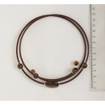 Колье из тигрового глаза на струнке, плоский овал 25х18мм, шарики 10мм и 8мм