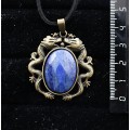 Кулон из лазурита ярко-синего однотонного, овал 25х18мм огранка, оправа цвет бронза "2 дракона"