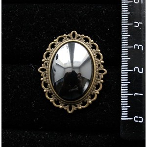 Брошь из гематита, овал 25х18мм, оправа с узором цвет бронза