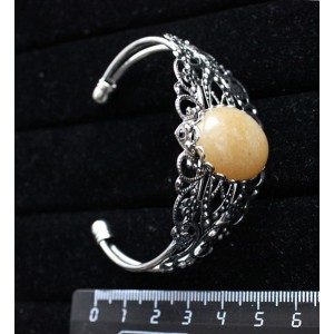 Браслет из авантюрина желтого, овал 25х18мм, жесткая основа, цвет ант.серебро