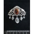 Брошь из янтаря темного (кабошон-мозаика) "трюмо", овал 18х13мм, со стразами и подвесками из горного хрусталя