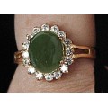Кольцо с нефритом "овал в цирконах"
