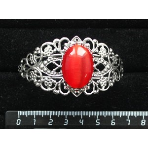 Браслет из кошачьего глаза (синт.),  цвет тёмно-оранжевый, овал 25х18мм, жесткая основа, цвет ант.серебро