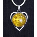 Кулон из янтаря (переплавленный), цвет желтый, круг 18мм, оправа "сердечко"