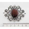 Брошь из бычьего глаза "филигрань", овал 25х18мм
