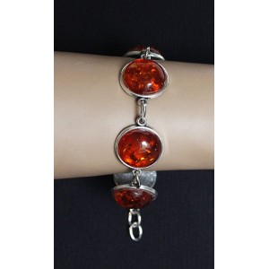 Браслет из янтаря (переплавленый)  на цепочке, цвет коньячный, 5 кабошонов, круг 18мм