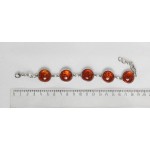 Браслет из янтаря (переплавленый)  на цепочке, цвет коньячный, 5 кабошонов, круг 18мм